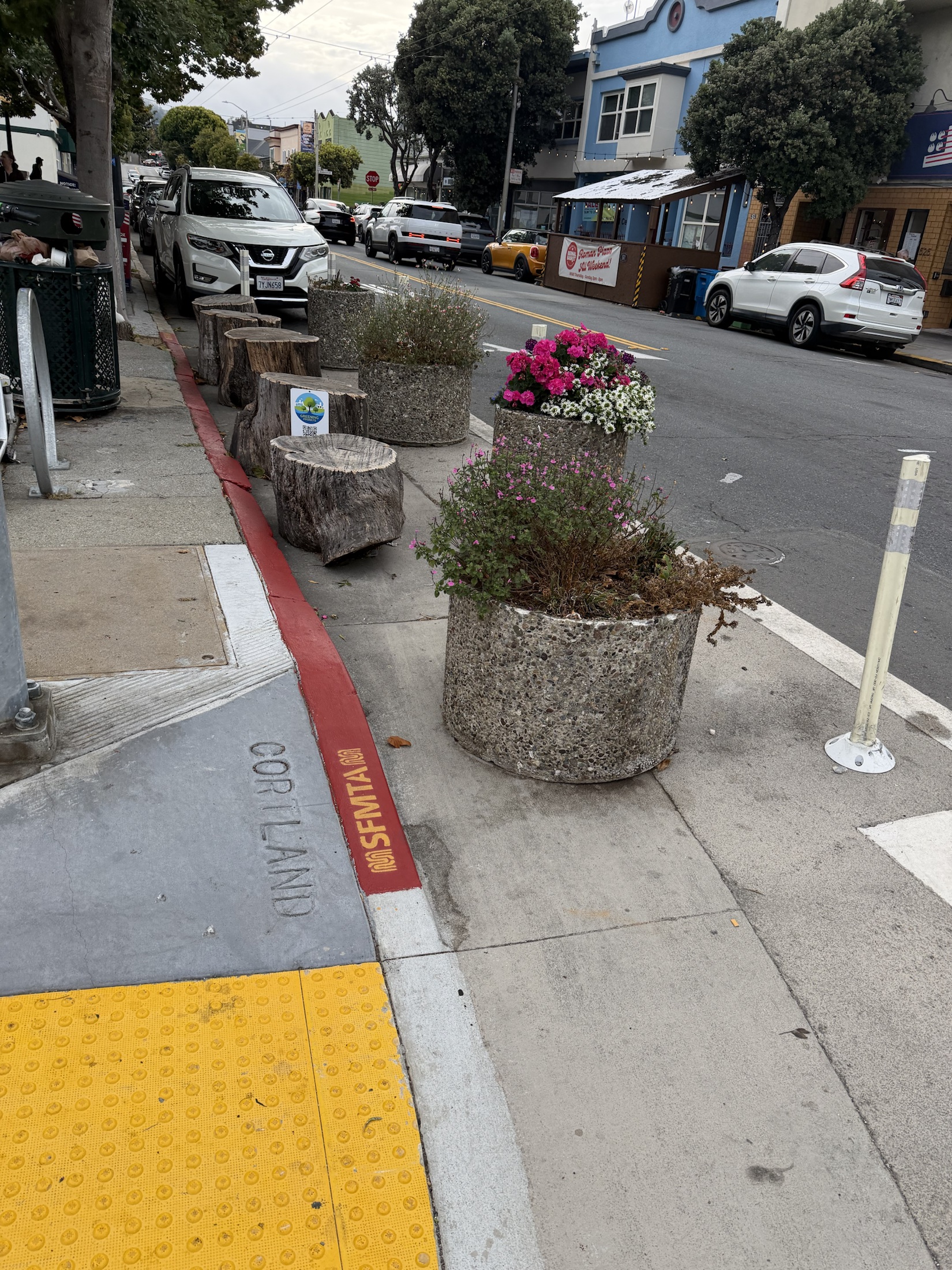 Flowering planters at a protected Cortland Avenue corner